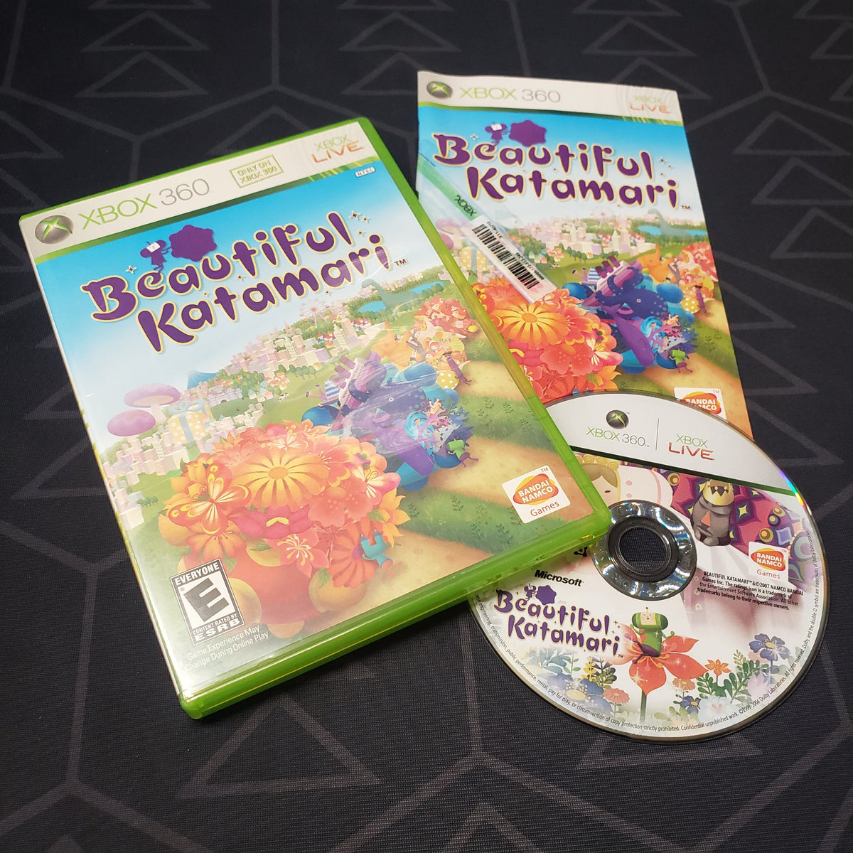 Image shows the case, manual and disc for the video game Beautiful Katamari for Xbox 360