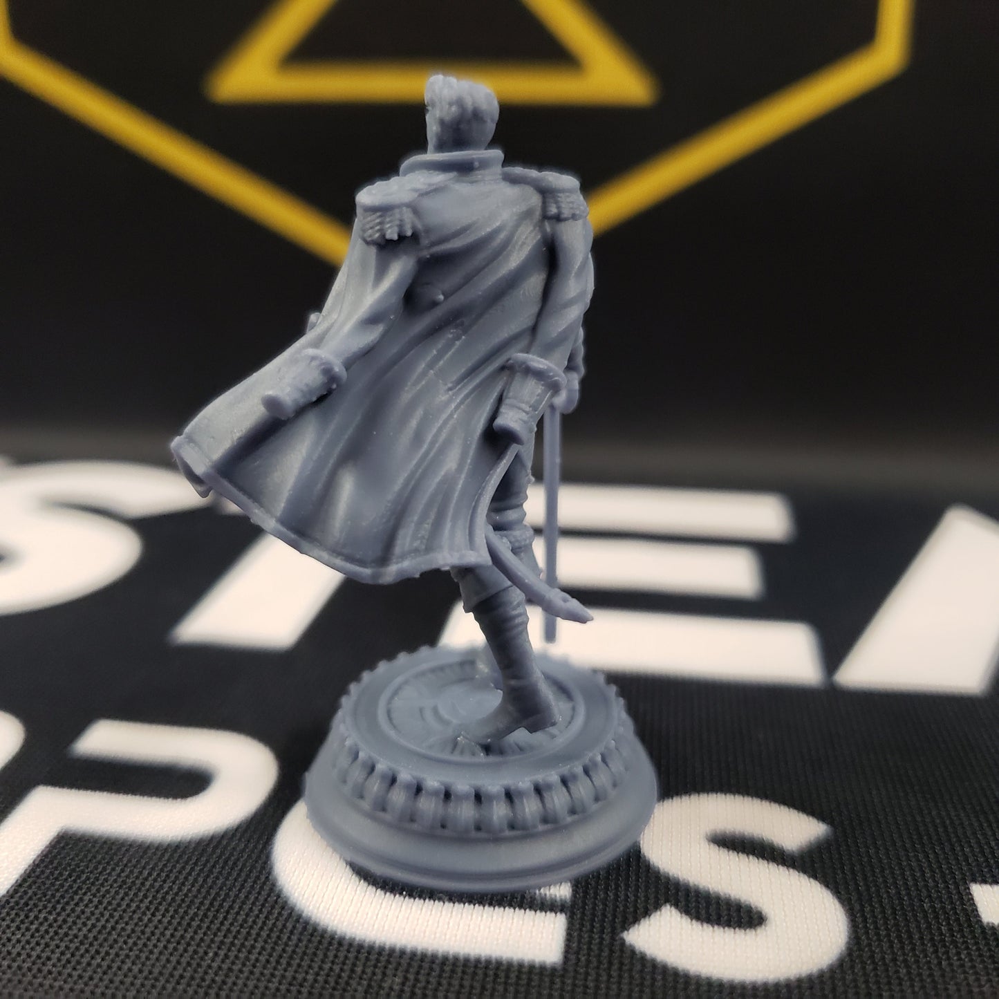 Image shows the back of a vampire general gaming miniature.