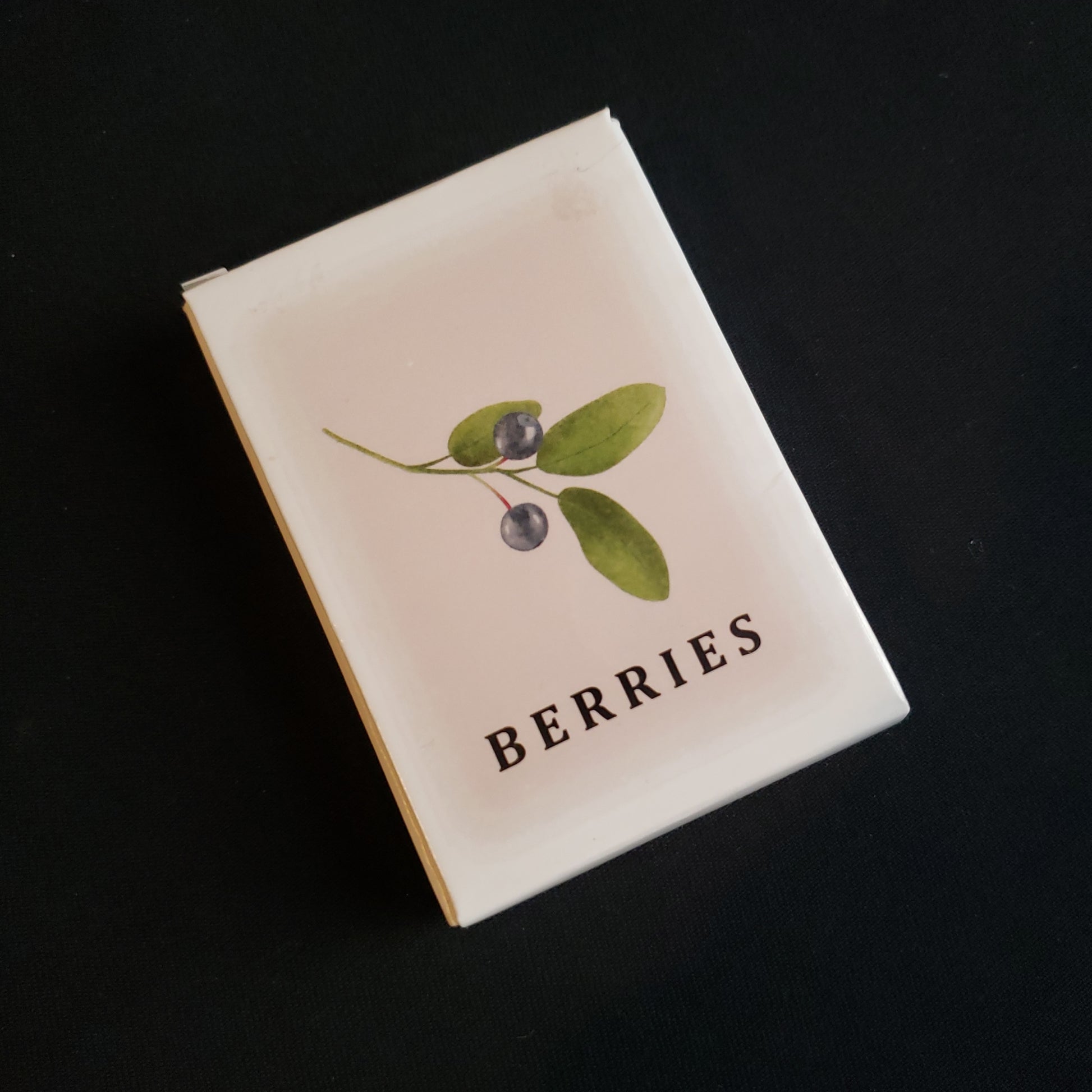 Image shows the front cover of the box of the Berries card game