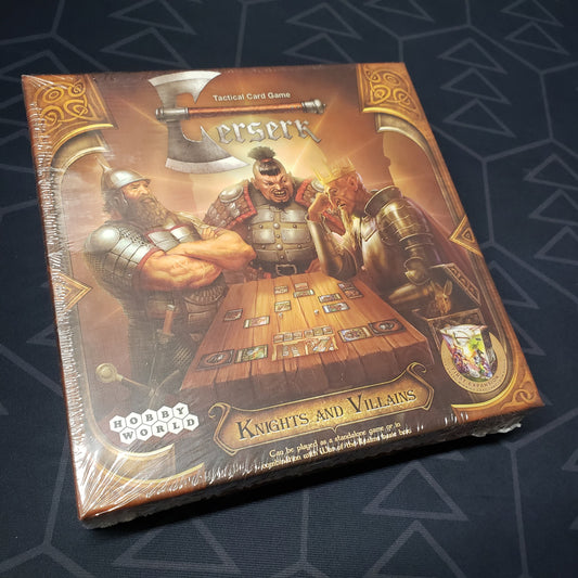 Image shows the front cover of the box of the Knights and Villains expansion for the card game Berserk