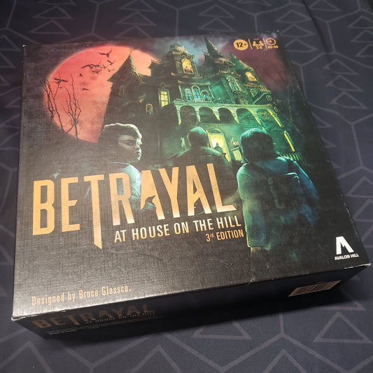 Image shows the front cover of the box for the board game Betrayal at House on the Hill (Third Edition)