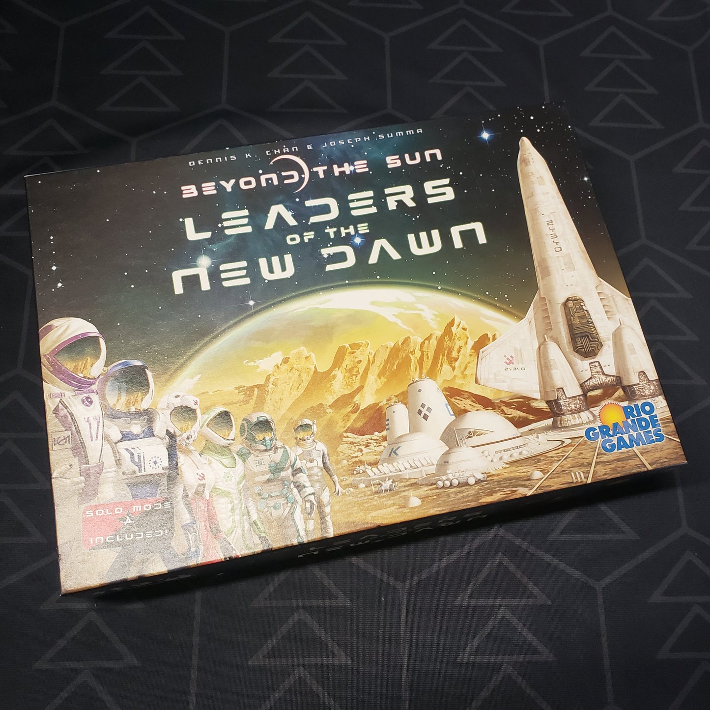 Image shows the front cover of the box of the Leaders of the New Dawn expansion for the board game Beyond the Sun
