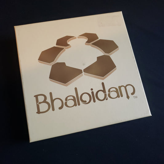 Image shows the front cover of the box of the Bhaloidam board game