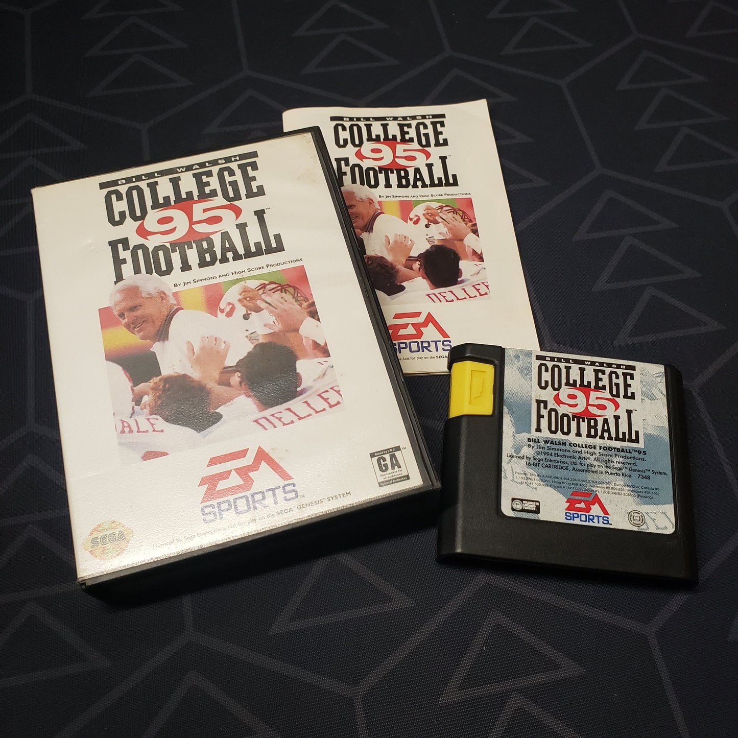 Image shows the case, manual and cartridge for the video game Bill Walsh College Football 95 for Sega Genesis