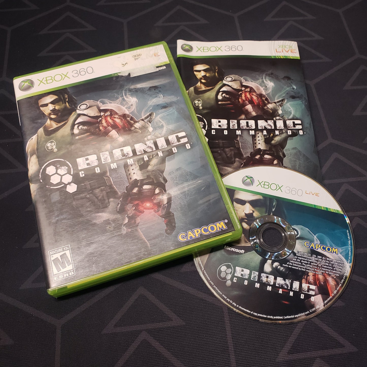Image shows the case, manual and disc for the video game Bionic Commando for Xbox 360