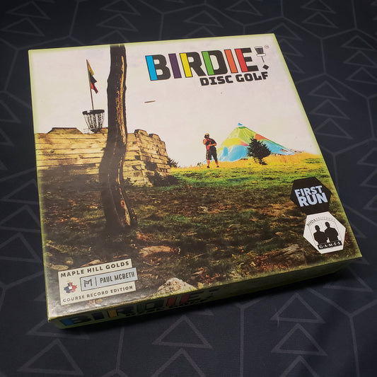 Image shows the front cover of the box for the BIRDIE! Disc Golf board game