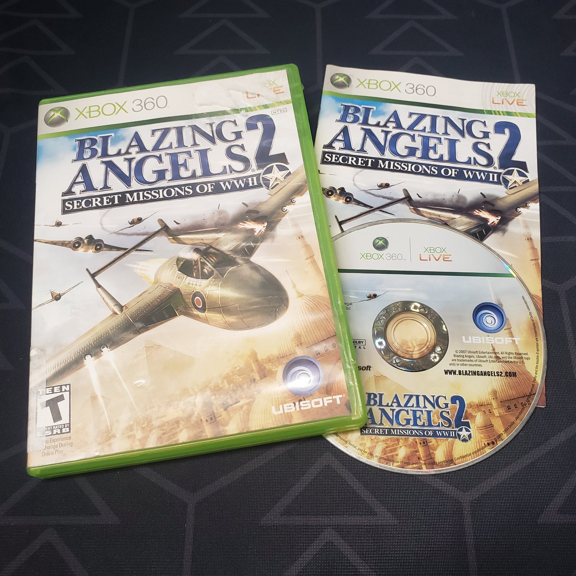 Image shows the case, manual & disc for the video game Blazing Angels 2: Secret Missions of WWII for Xbox 360