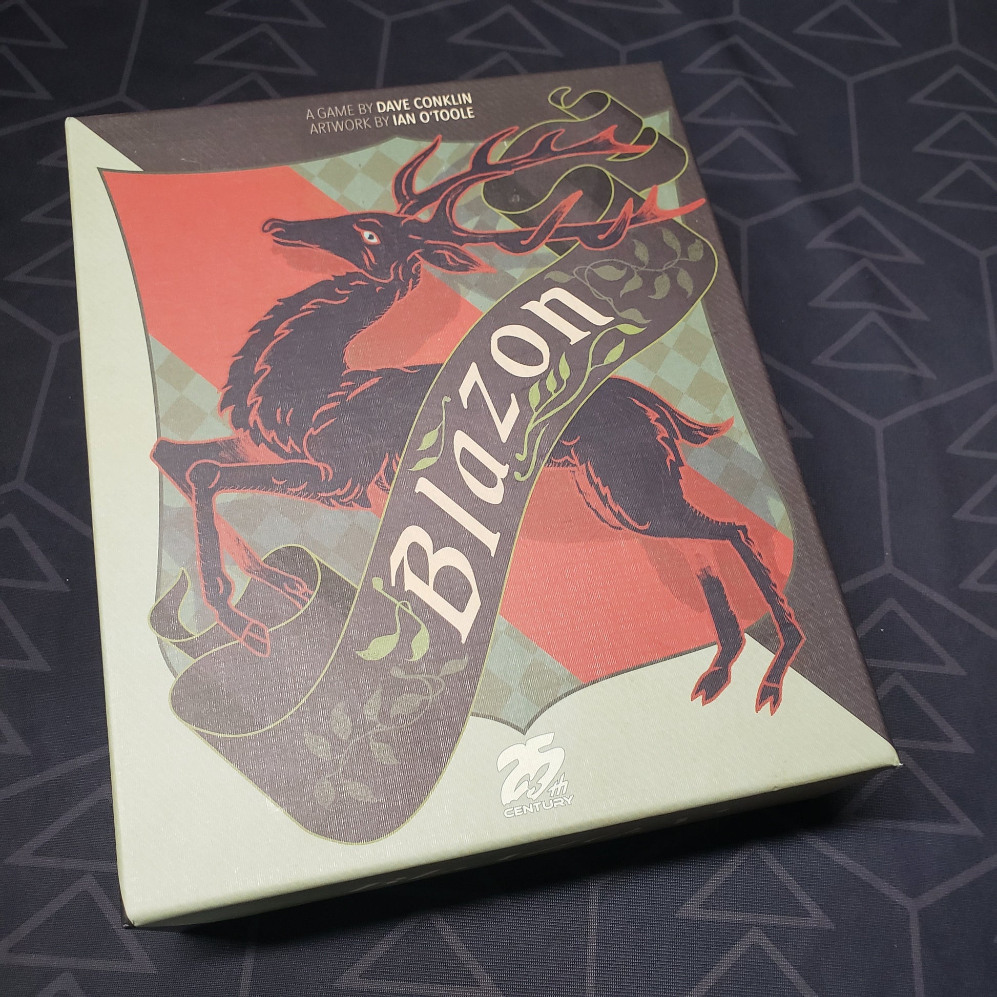 Image shows the front cover of the box for the Blazon board game