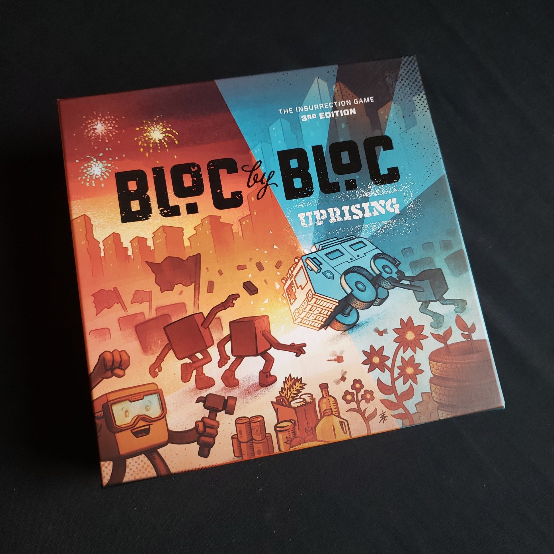 Image shows the front cover of the box of the Bloc by Bloc: Uprising board game