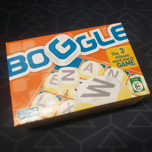 Image shows the front cover of the box for the Boggle dice game