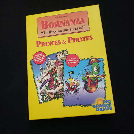 Image shows the front cover of the box of the Princes & Pirates expansion for the card game Bohnanza