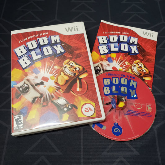 Image shows the case, manual and disc for the video game Boom Blox for Nintendo Wii