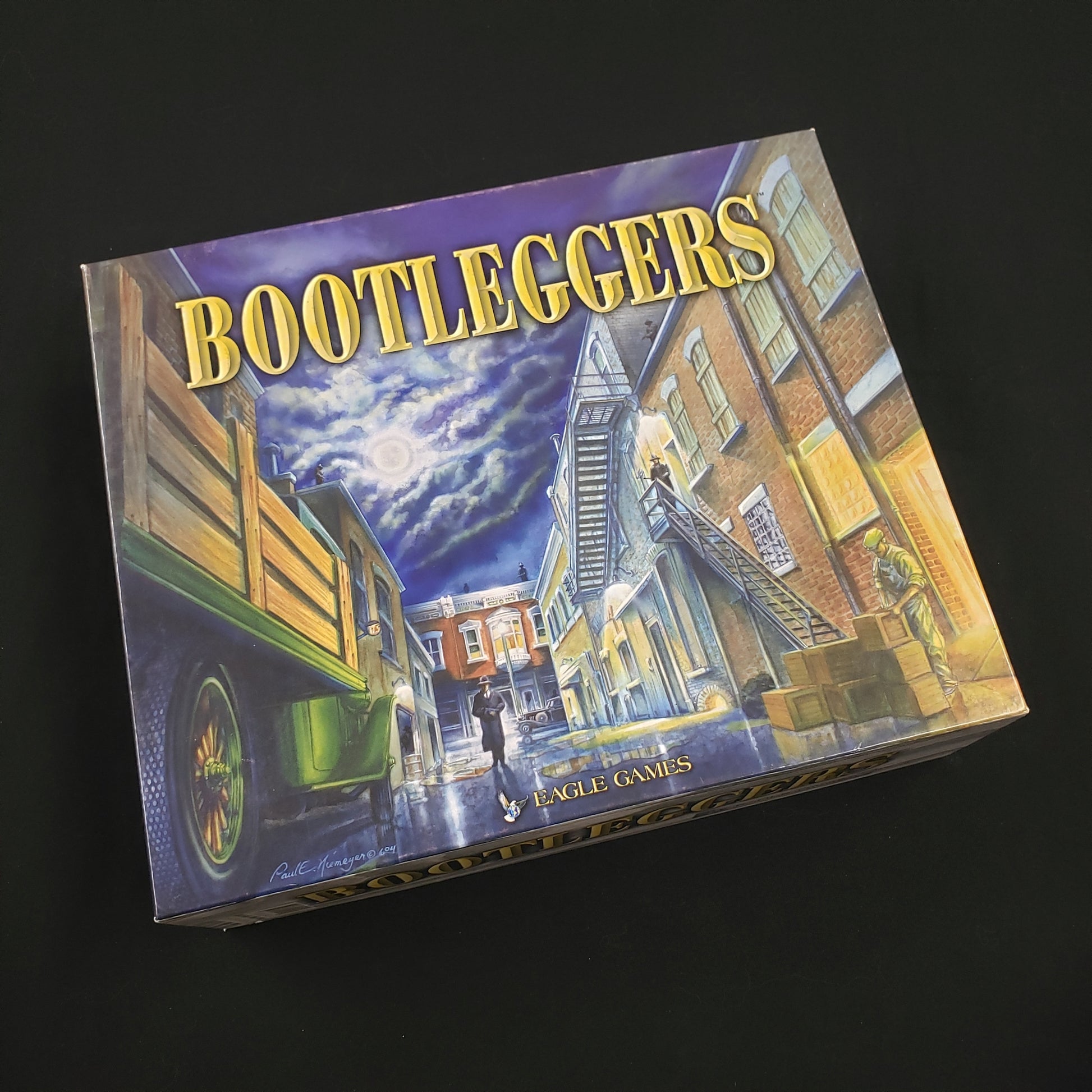 Image shows the front cover of the box of the Bootleggers board game