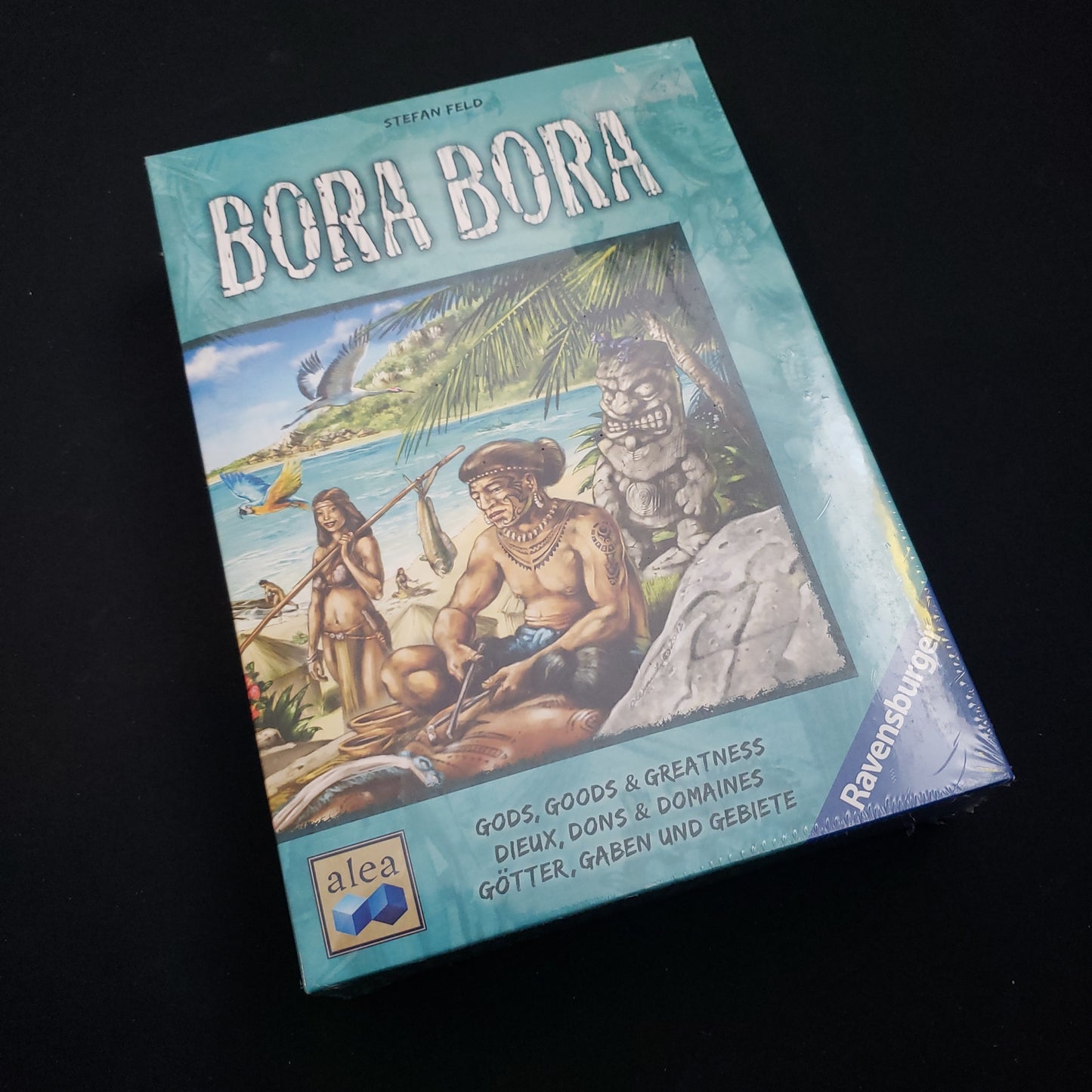 Image shows the front cover of the box of the Bora Bora board game