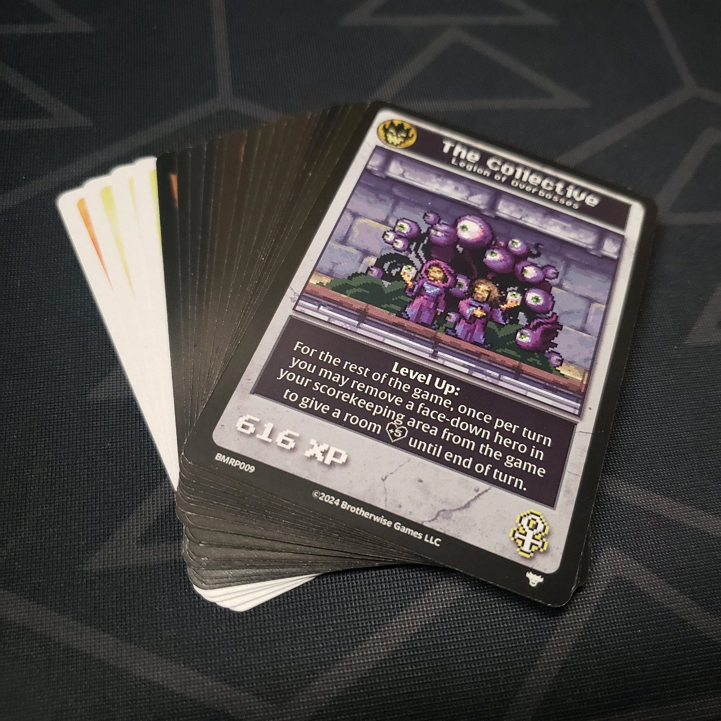 Image shows the fanned-out cards for the Reprints Pack expansion for the card game Boss Monster