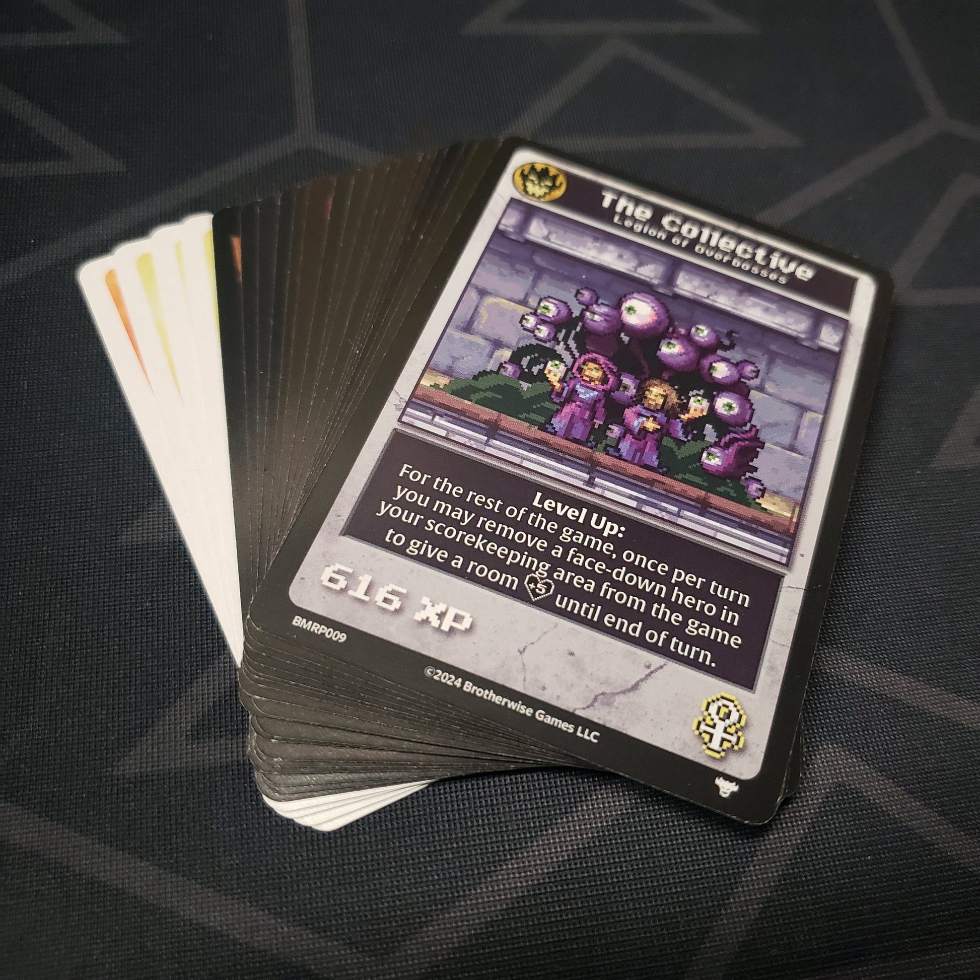 Image shows the fanned-out cards for the Reprints Pack expansion for the card game Boss Monster
