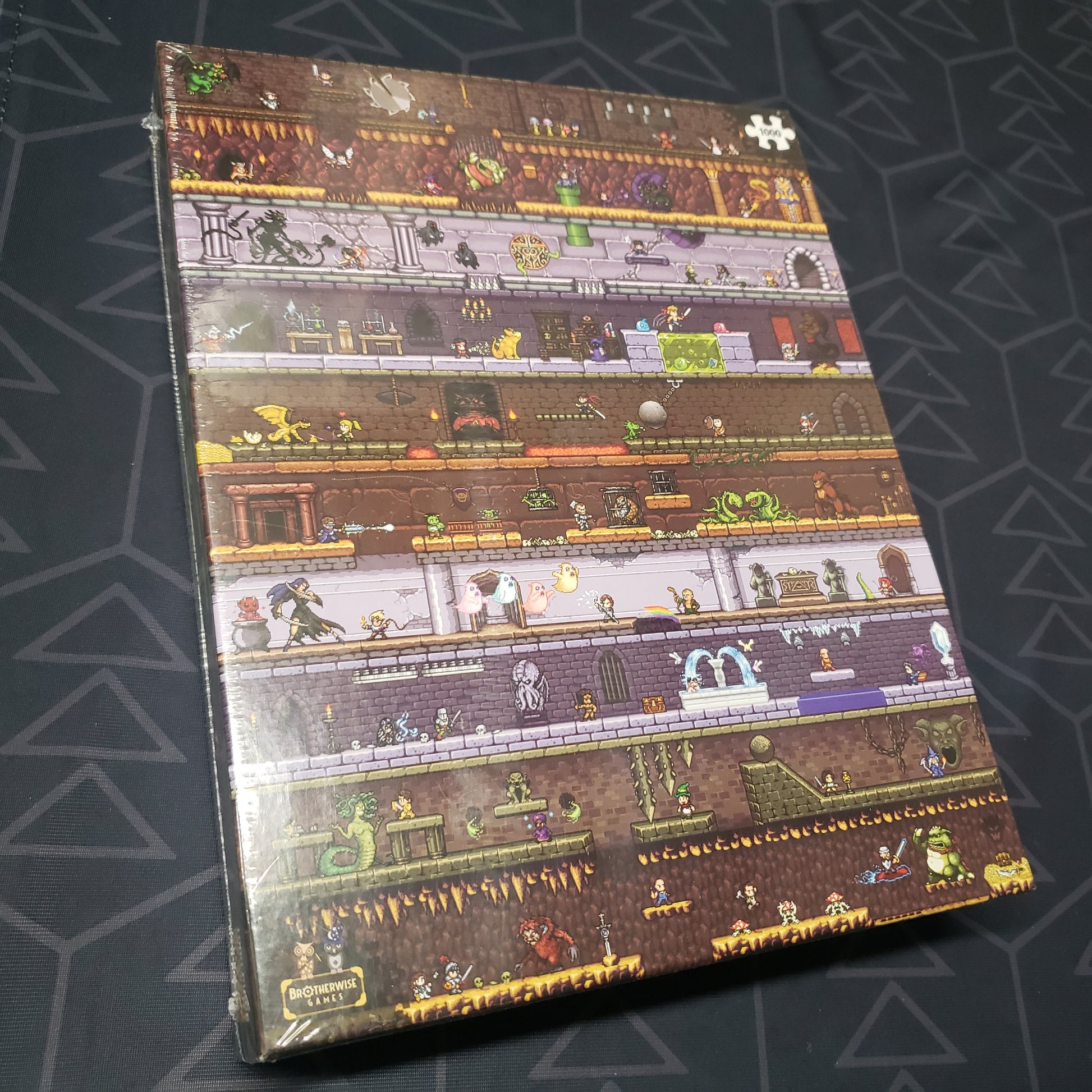 Image shows the front cover of the box for the Boss Monster: The Dungeon Strikes Back crowdfunding-exclusive puzzle