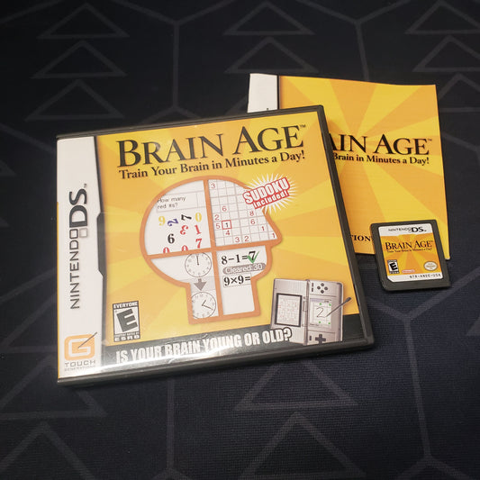 Image shows the case, manual & cartridge for the video game Brain Age for Nintendo DS