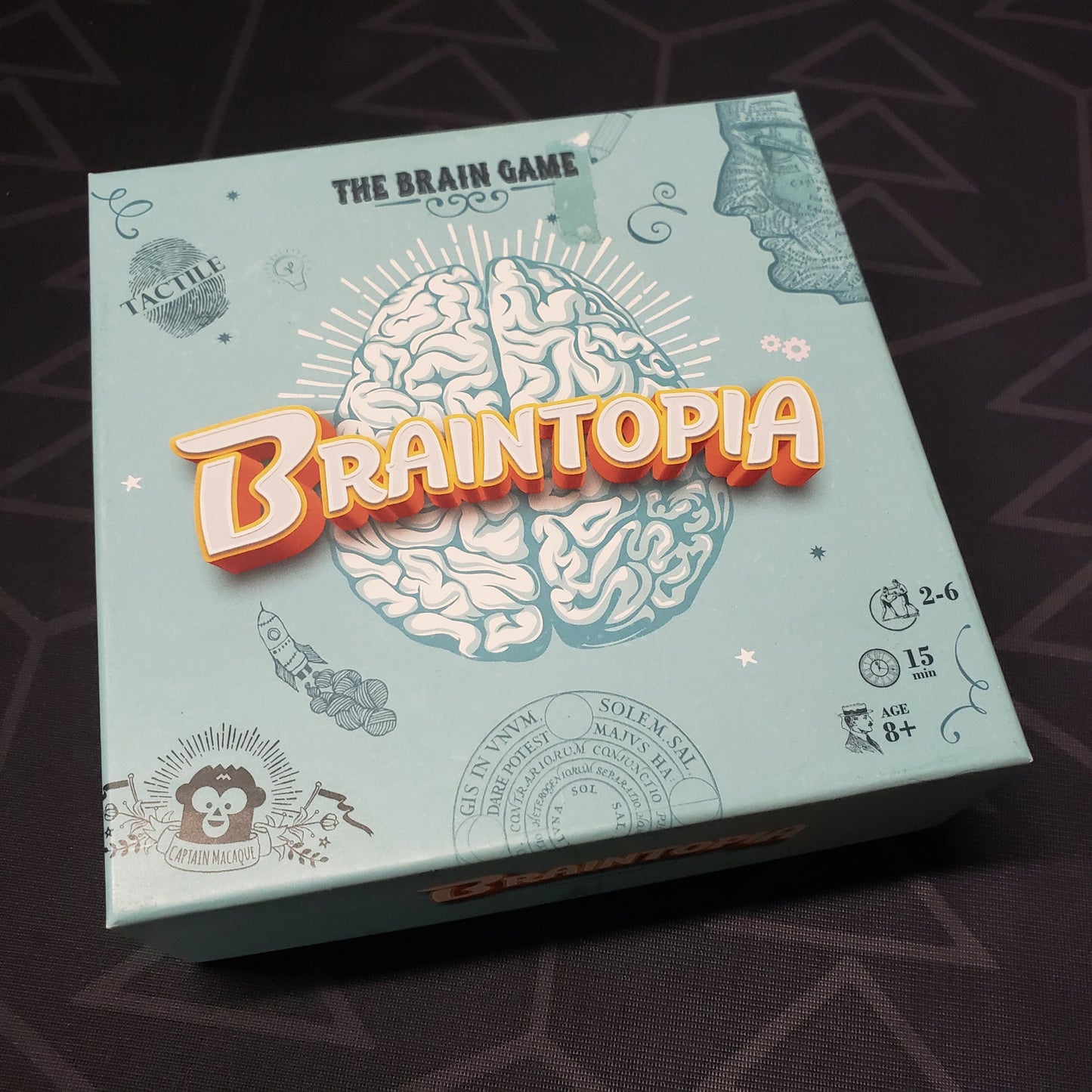 Image shows the front cover of the box for the Braintopia card game