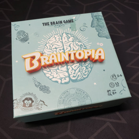 Image shows the front cover of the box for the Braintopia card game