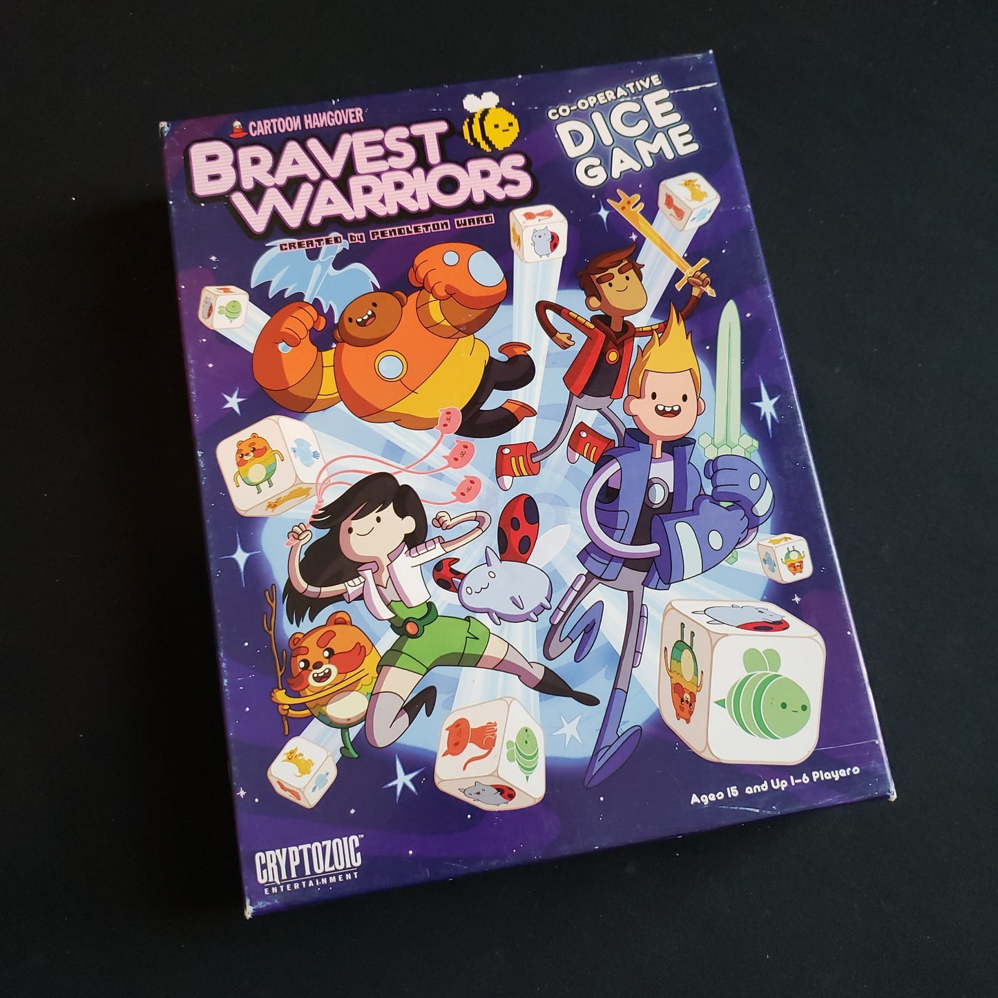 Image shows the front cover of the box of the Bravest Warriors Cooperative Dice game