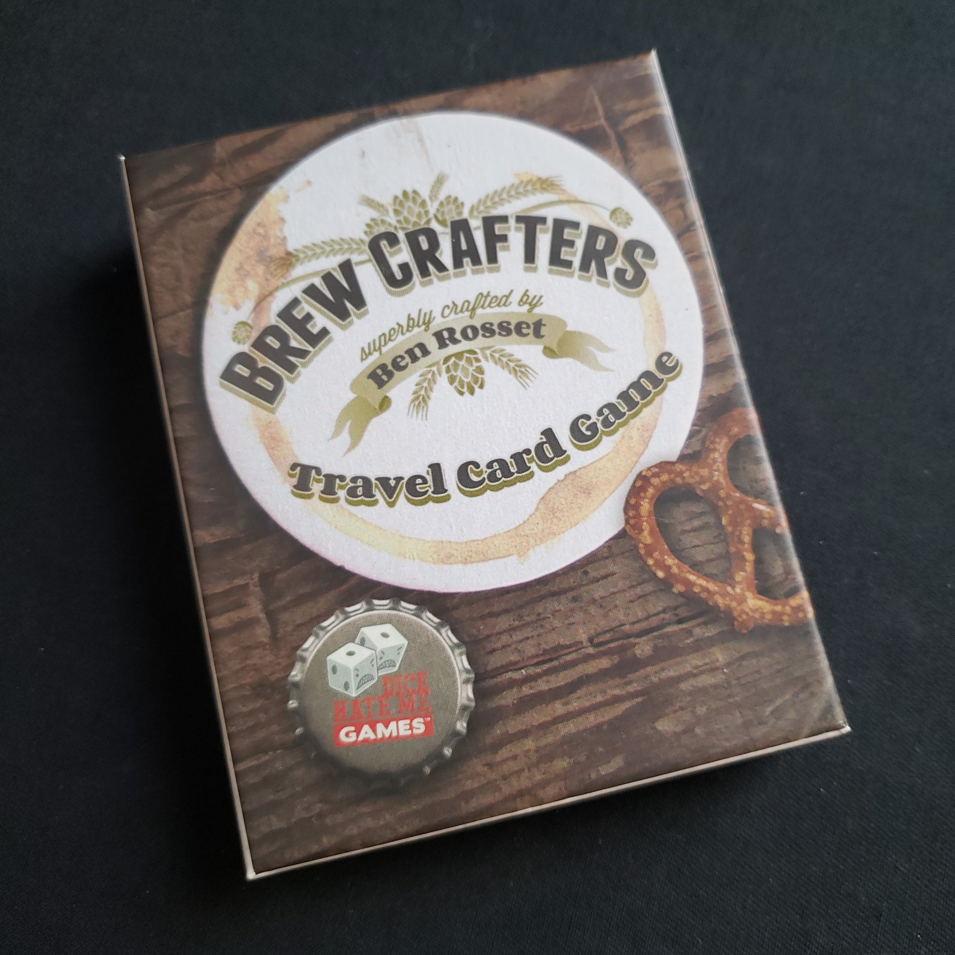 Image shows the front cover of the box of the Brew Crafters: Travel Card Game
