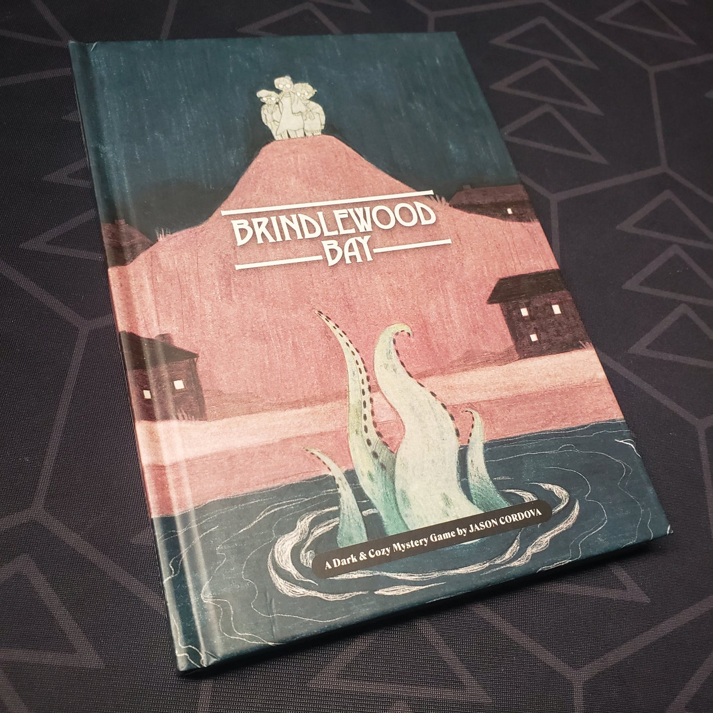 Image shows the front cover of the core rulebook for the Brindlewood Bay roleplaying game