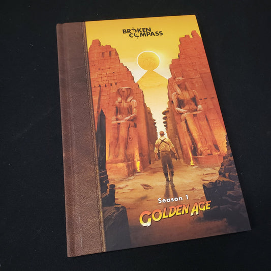 Image shows the front cover of the Season 1: Golden Age book for the roleplaying game Broken Compass