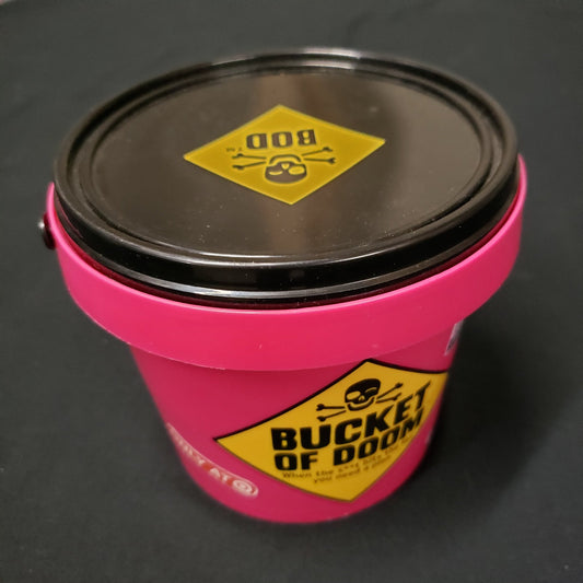Image shows the outside of the bucket packaging of the box of the Bucket of Doom card game
