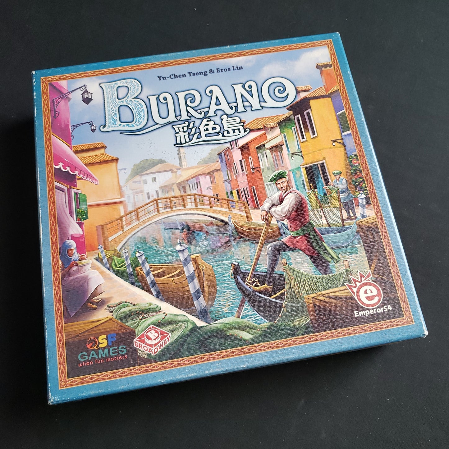 Image shows the front cover of the box of the Burano board game