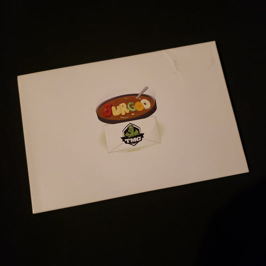 Image shows the front cover of the box of the Burgoo card game