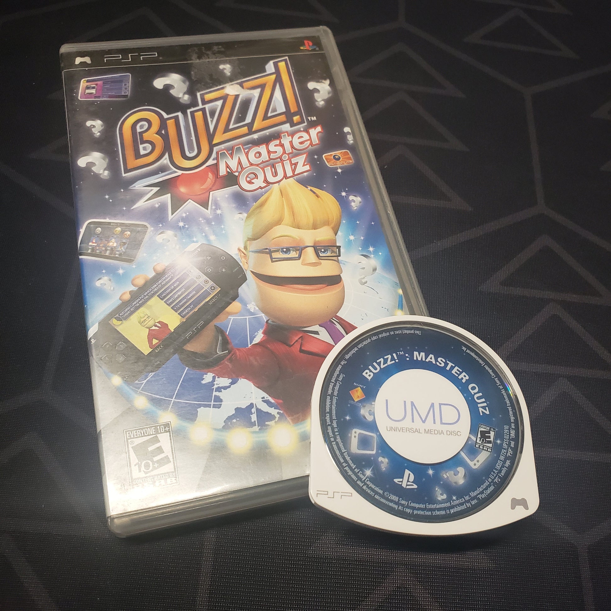 Image shows the case and UMD disc for the video game Buzz! Master Quiz for Playstation Portable