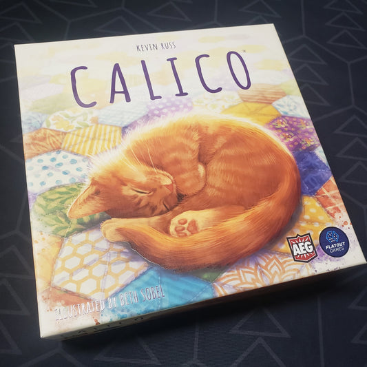 Image shows the front cover of the box of the Calico board game