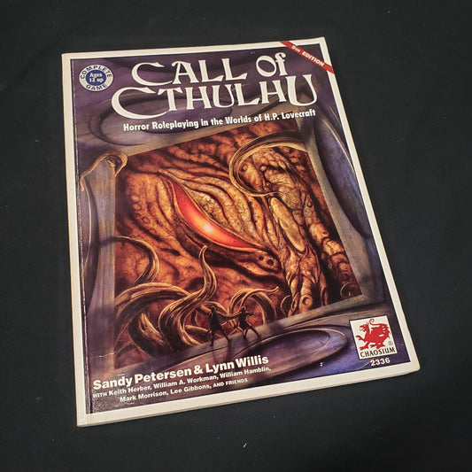 Image shows the front cover of the core rulebook for the roleplaying game Call of Cthulhu: Fifth Edition
