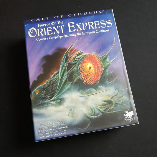 Image shows the front cover of the box of the Horror on the Orient Express luxury campaign setting for the Call of Cthulhu roleplaying game