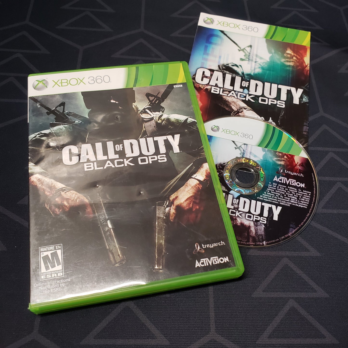 Image shows the case, manual and disc for the video game Call of Duty: Black Ops for Xbox 360