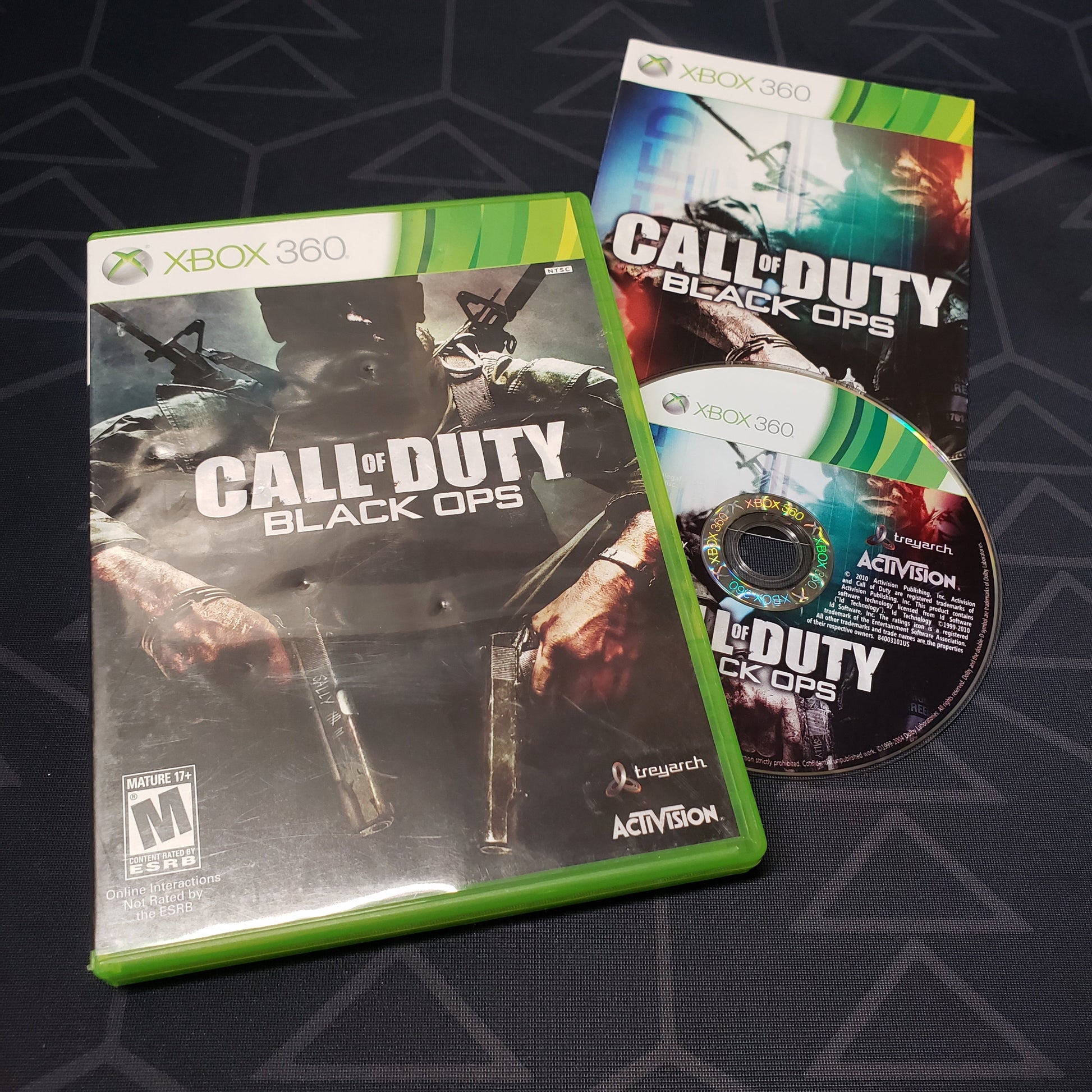 Image shows the case, manual and disc for the video game Call of Duty: Black Ops for Xbox 360