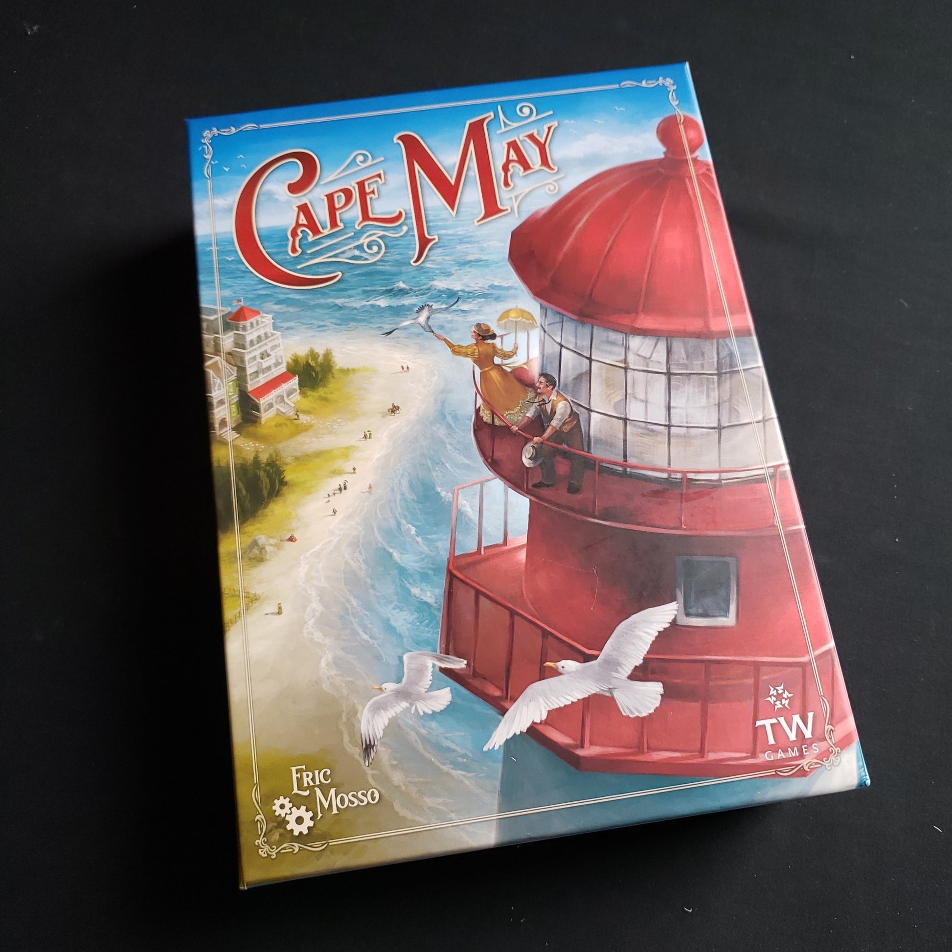 Image shows the front cover of the box of the Cape May board game