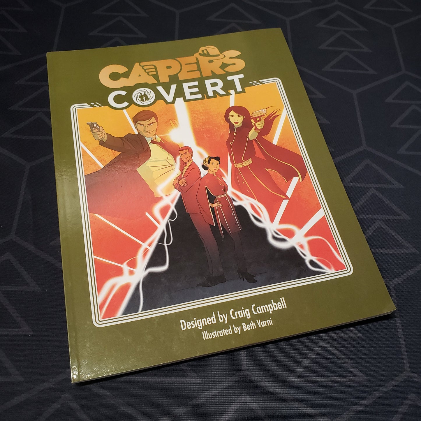 Image shows the front cover of the Covert book for the roleplaying game CAPERS