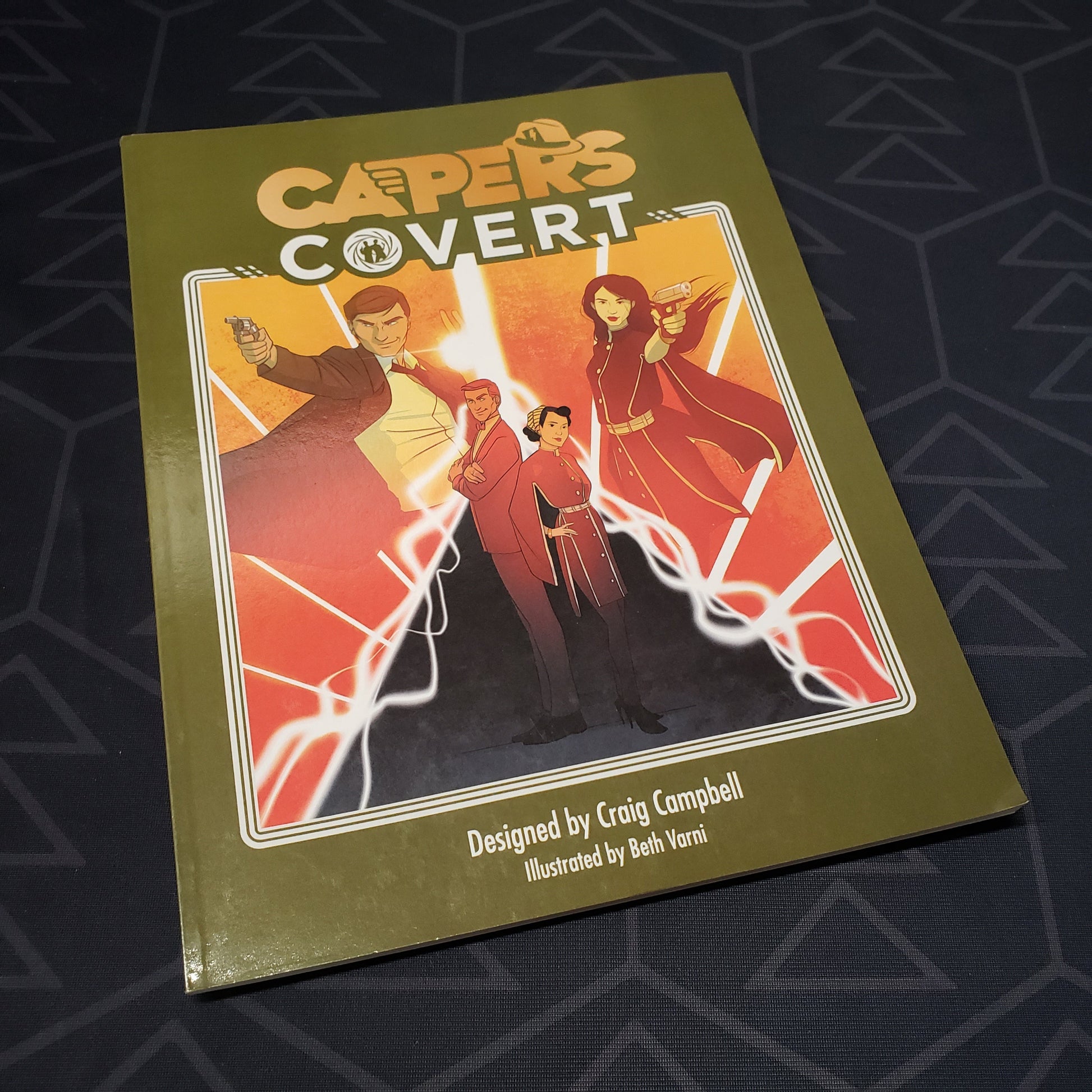 Image shows the front cover of the Covert book for the roleplaying game CAPERS