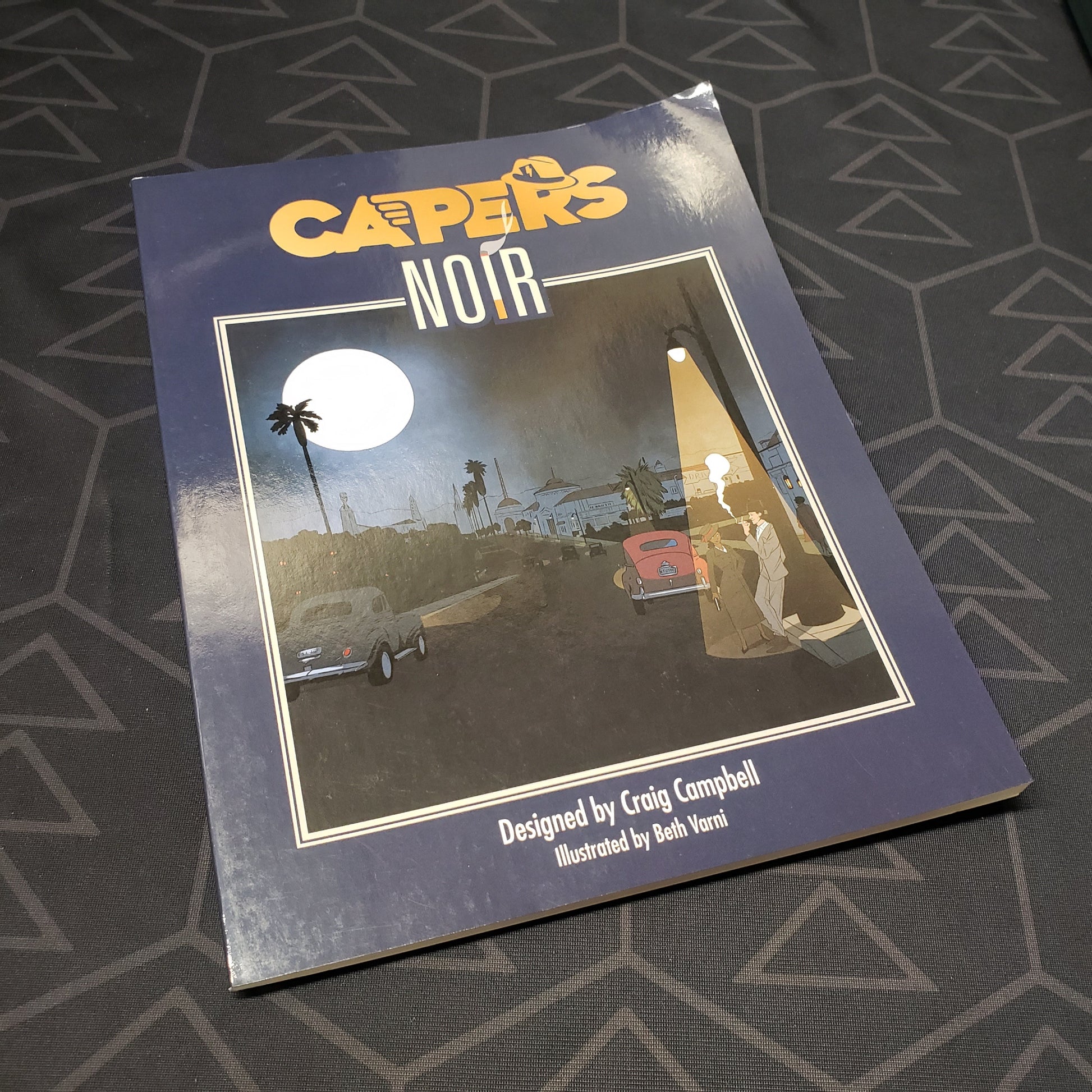 Image shows the front cover of the Noir book for the roleplaying game CAPERS