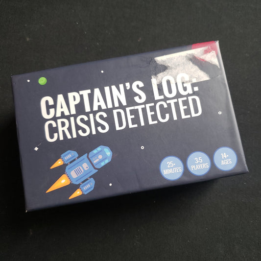 Image shows the front cover of the box of the Captain's Log: Crisis Detected card game