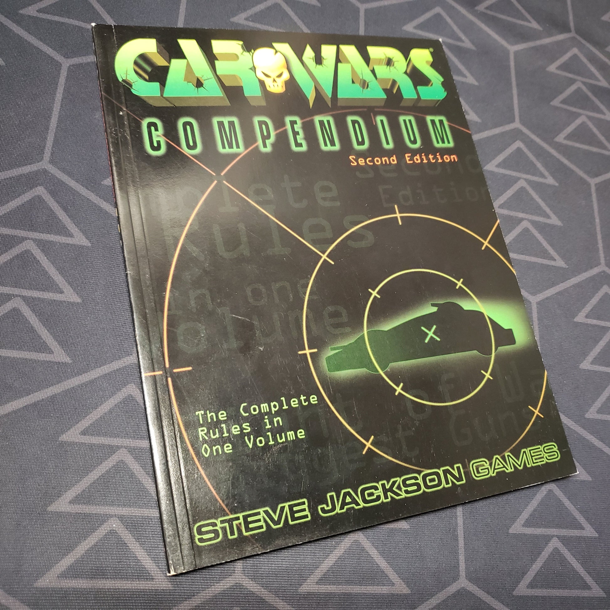 Image shows the front cover of the Car Wars: Compendium (Second Edition) roleplaying game book