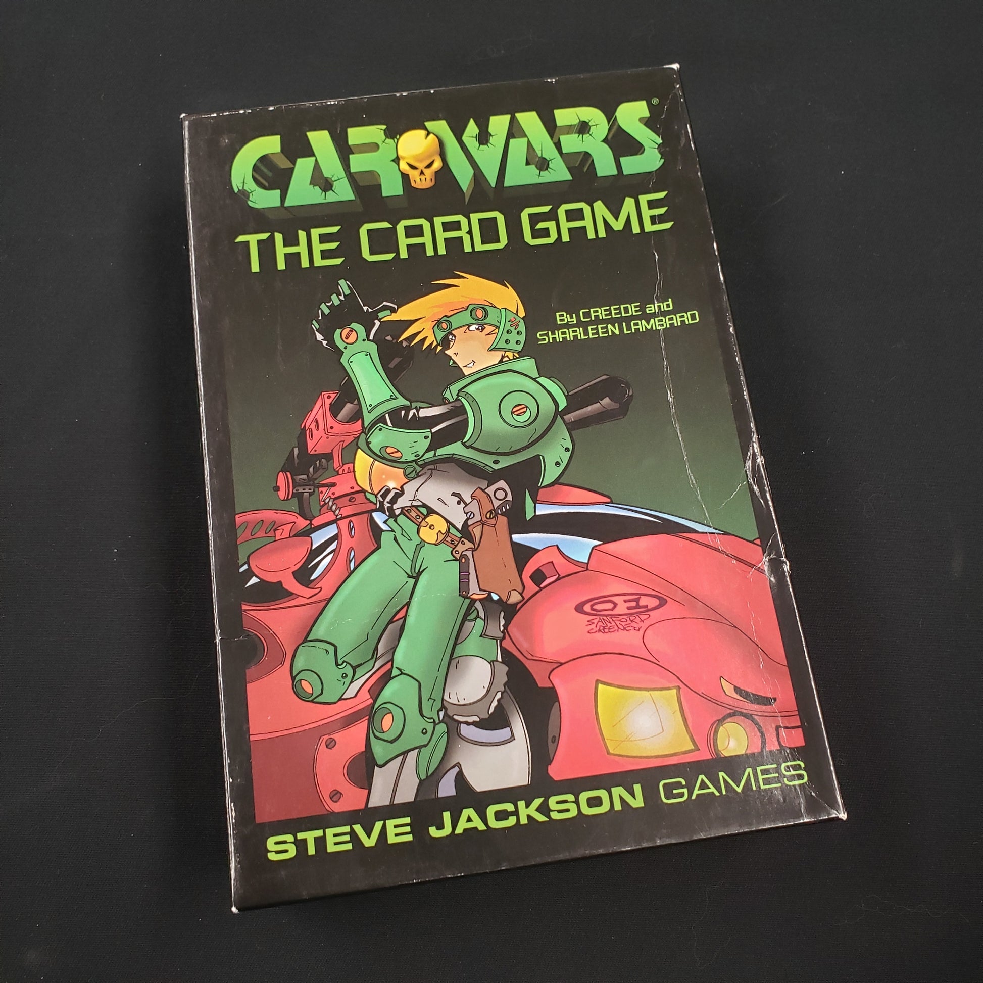 Image shows the front cover of the box of Car Wars: The Card Game