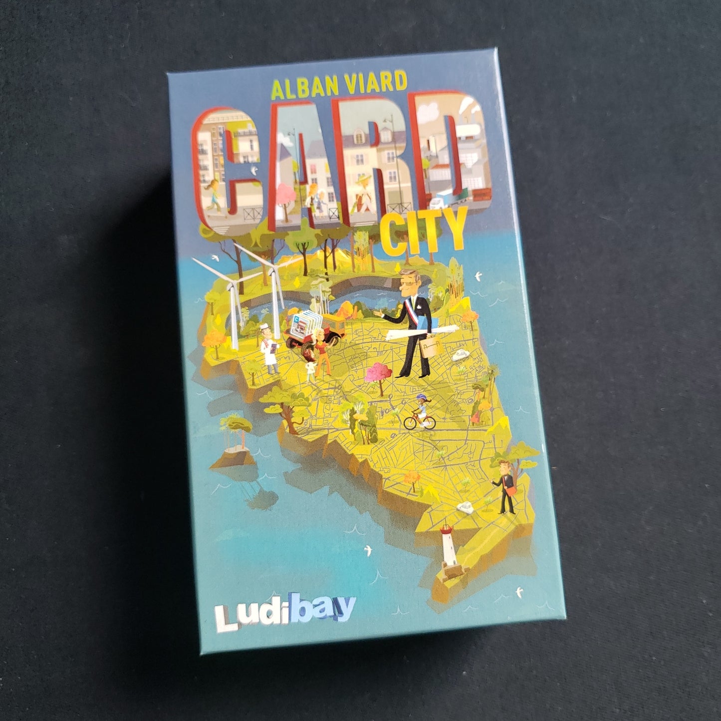 Image shows the front cover of the box of the Card City card game