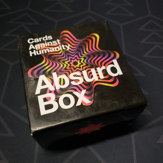 Image shows the front of the box for the Absurd Box expansion for the card game Cards Against Humanity