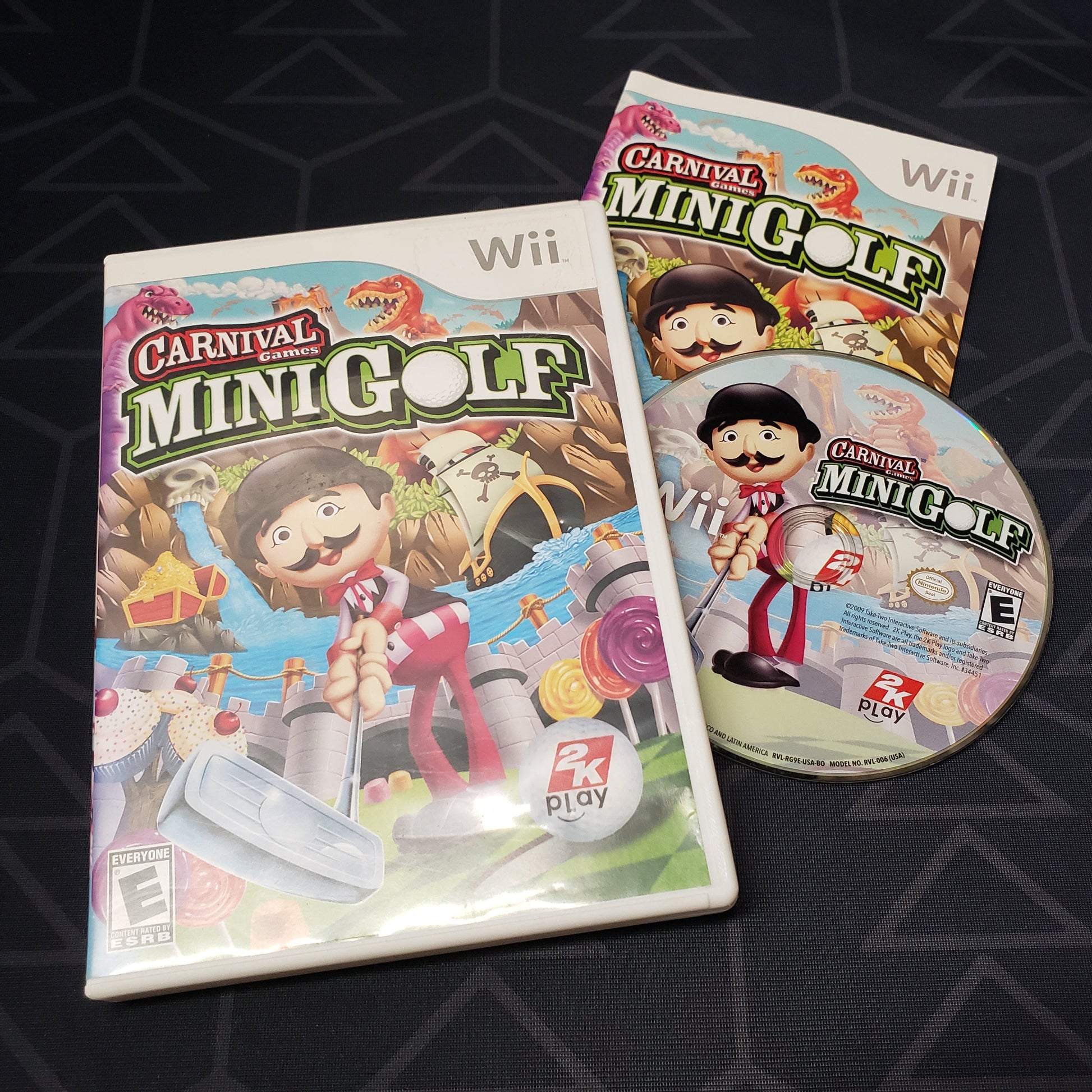 Image shows the case, manual and disc for the video game Carnival Games: Mini Golf for Nintendo Wii