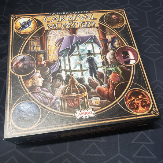 Image shows the front cover of the box of the Carnival of Monsters board game