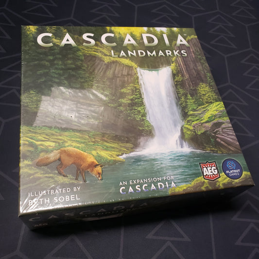 Image shows the front cover of the box of the Landmarks expansion for the board game Cascadia