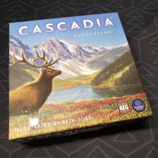 Image shows the front cover of the box of the Cascadia board game